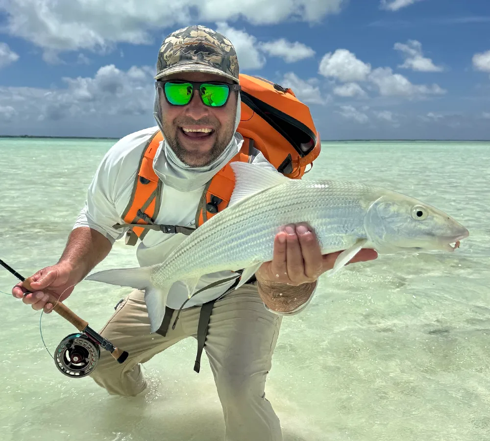JR Loiland with Bonefish Bonefish the shallow saltwater flats of Christmas Island, a world-class destination for anglers.